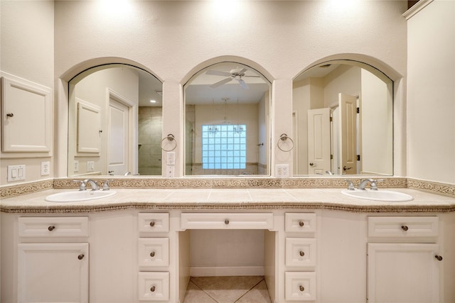 4035 Gramercy St, Houston, TX 77025 - bathroom with double vanity, a ceiling fan, and tile patterned flooring