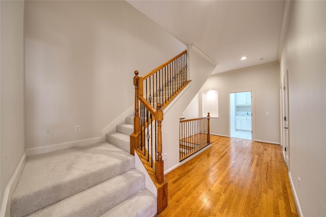 4035 Gramercy St, Houston, TX 77025 - staircase with ornamental molding, wood finished floors, and recessed lighting