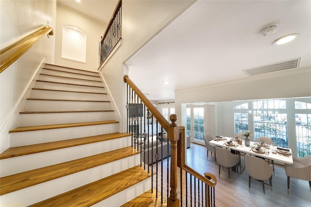 4035 Gramercy St, Houston, TX 77025 - stairs with crown molding, wood finished floors, and recessed lighting