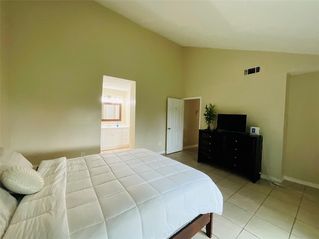 6404 Quail Meadow Dr, Houston, TX 77035 - bedroom with light tile patterned flooring, high vaulted ceiling, and ensuite bath