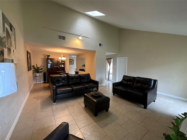 6404 Quail Meadow Dr, Houston, TX 77035 - living area featuring a chandelier, high vaulted ceiling, light tile patterned floors, and a skylight