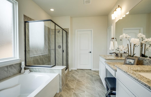 15898 Hayes Market Loop, Conroe, TX 77302 - full bath featuring vanity, a shower stall, a bath, and recessed lighting