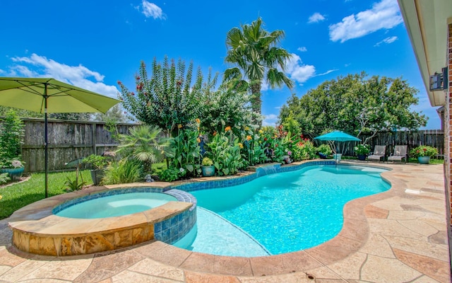 15411 Dundas Dr, Cypress, TX 77429 - view of swimming pool with a fenced backyard, a patio, and a pool with connected hot tub