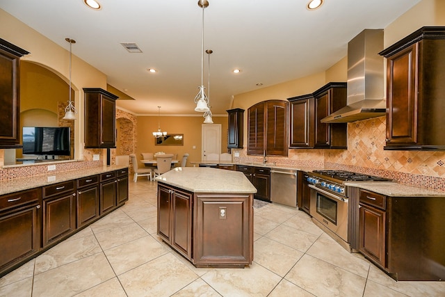 27814 Cenizo Park Ct, Katy, TX 77494 - kitchen with stainless steel appliances, wall chimney exhaust hood, tasteful backsplash, light tile patterned floors, and dark brown cabinets