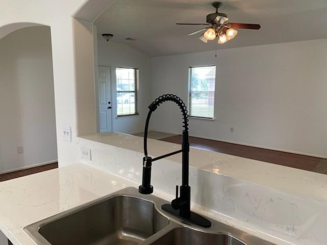 9530 Alex Springs Ln, Houston, TX 77044 - kitchen view of ceiling fan and arched walkways