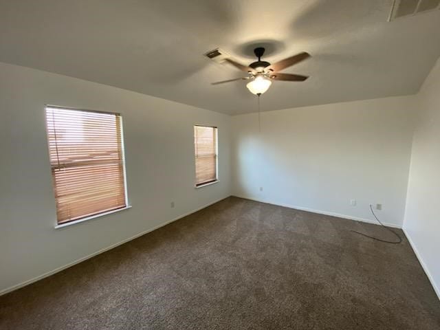 9530 Alex Springs Ln, Houston, TX 77044 - spare room with ceiling fan and dark colored carpet