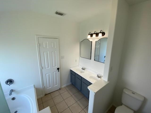 9530 Alex Springs Ln, Houston, TX 77044 - full bath with a garden tub, tile patterned floors, and double vanity