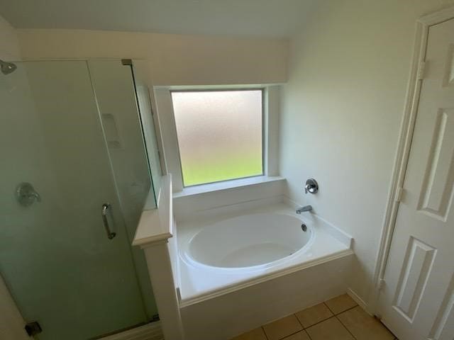 9530 Alex Springs Ln, Houston, TX 77044 - full bathroom featuring a stall shower, a garden tub, and tile patterned floors