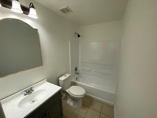9530 Alex Springs Ln, Houston, TX 77044 - full bath with vanity, tile patterned floors, and shower / washtub combination