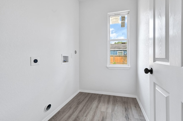 7939 Goode St, Houston, TX 77012 - laundry area featuring electric dryer hookup, hookup for a washing machine, and wood finished floors