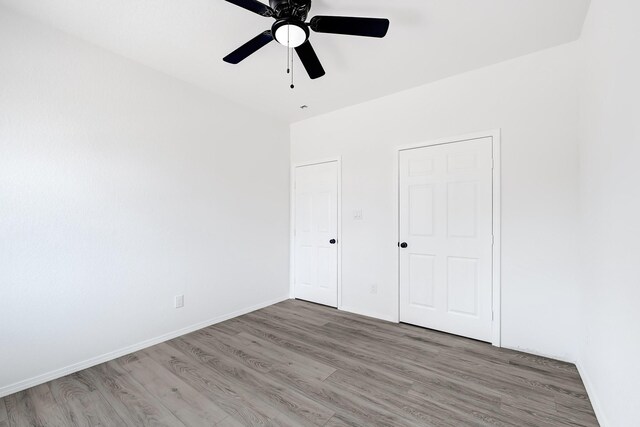 7939 Goode St, Houston, TX 77012 - unfurnished bedroom featuring wood finished floors and ceiling fan