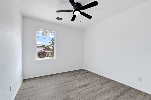7939 Goode St, Houston, TX 77012 - empty room featuring wood finished floors and a ceiling fan