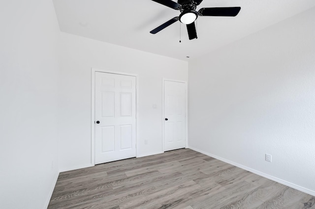 7939 Goode St, Houston, TX 77012 - unfurnished bedroom with light wood-style flooring and ceiling fan