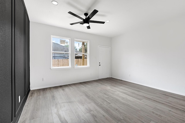 7939 Goode St, Houston, TX 77012 - spare room featuring light wood finished floors, a ceiling fan, and recessed lighting