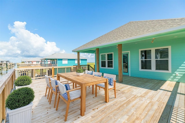 591 Pompano Dr, Freeport, TX 77541 - wooden terrace with outdoor dining space