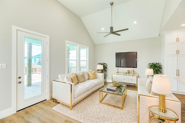 591 Pompano Dr, Freeport, TX 77541 - living room featuring ceiling fan, light wood finished floors, and high vaulted ceiling