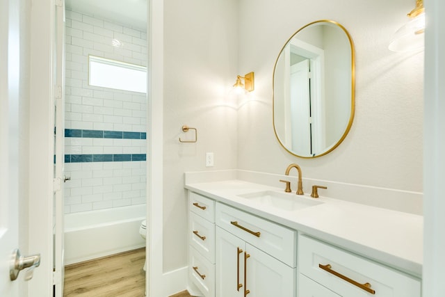 591 Pompano Dr, Freeport, TX 77541 - bathroom with vanity, wood finished floors, and shower / bathtub combination
