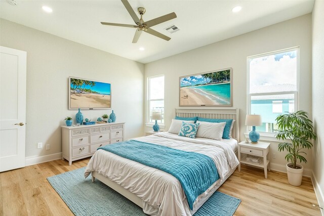 591 Pompano Dr, Freeport, TX 77541 - bedroom with light wood finished floors, recessed lighting, and ceiling fan