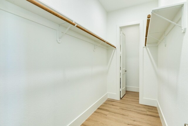 591 Pompano Dr, Freeport, TX 77541 - walk in closet with light wood-style flooring