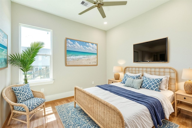 591 Pompano Dr, Freeport, TX 77541 - bedroom featuring wood finished floors, recessed lighting, and a ceiling fan