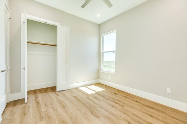 591 Pompano Dr, Freeport, TX 77541 - unfurnished bedroom with wood finished floors, a closet, ceiling fan, and recessed lighting