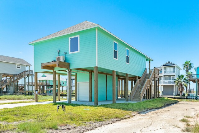 591 Pompano Dr, Freeport, TX 77541 - view of front of property with stairs and a carport