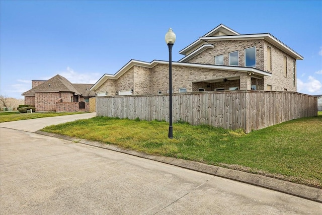 7722 Pond Cir, Beaumont, TX 77707 - view of property exterior featuring brick siding and driveway