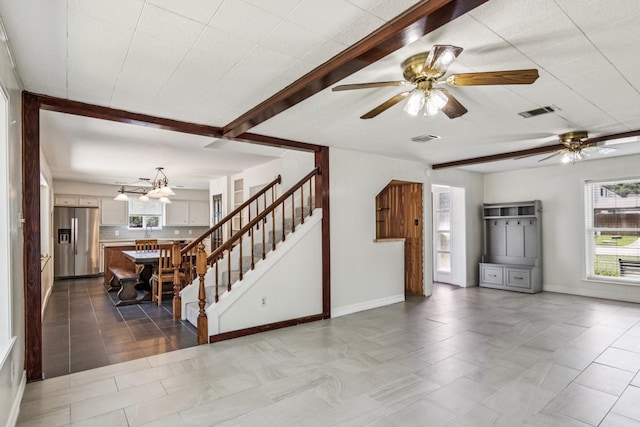 7927 Litchfield Ln, Spring, TX 77379 - unfurnished living room with ceiling fan and stairs