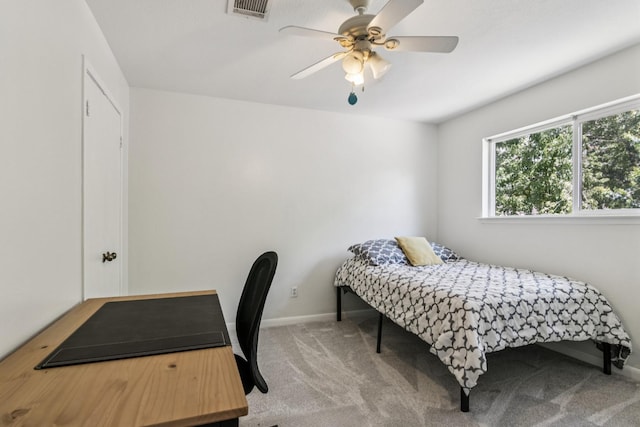 7927 Litchfield Ln, Spring, TX 77379 - carpeted bedroom with baseboards and ceiling fan