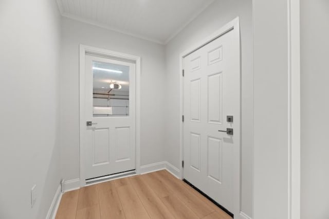 4406 Merwin St, Houston, TX 77027 - doorway to outside with crown molding and light wood-style floors