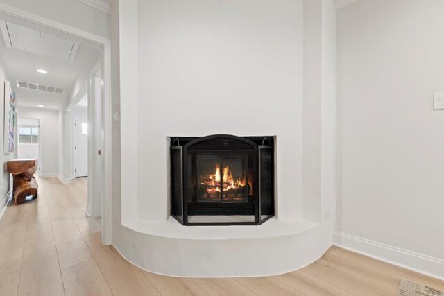 4406 Merwin St, Houston, TX 77027 - detailed view of wood finished floors and a glass covered fireplace