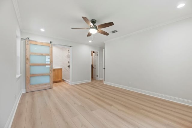 4406 Merwin St, Houston, TX 77027 - unfurnished bedroom with recessed lighting, light wood-type flooring, ornamental molding, a barn door, and ceiling fan