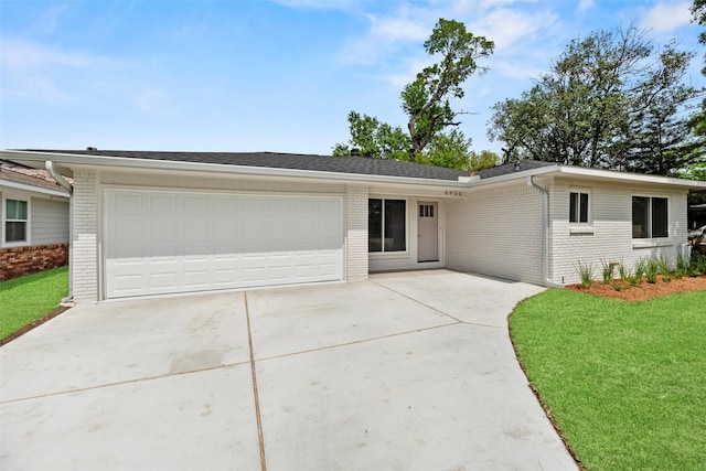 4406 Merwin St, Houston, TX 77027 - ranch-style house with brick siding, concrete driveway, a garage, and a front lawn