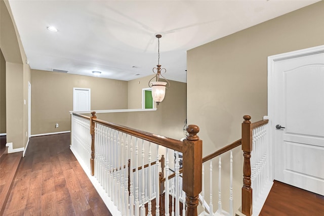 13322 Castlecombe Dr, Houston, TX 77044 - hallway featuring an upstairs landing and dark wood finished floors
