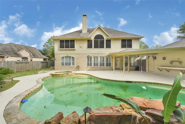 13322 Castlecombe Dr, Houston, TX 77044 - view of pool featuring a fenced backyard, a patio, and a pool with connected hot tub