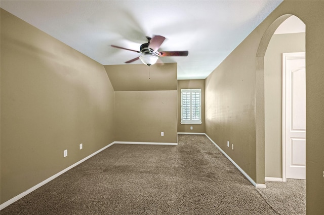 13322 Castlecombe Dr, Houston, TX 77044 - unfurnished room featuring ceiling fan, arched walkways, carpet flooring, and vaulted ceiling