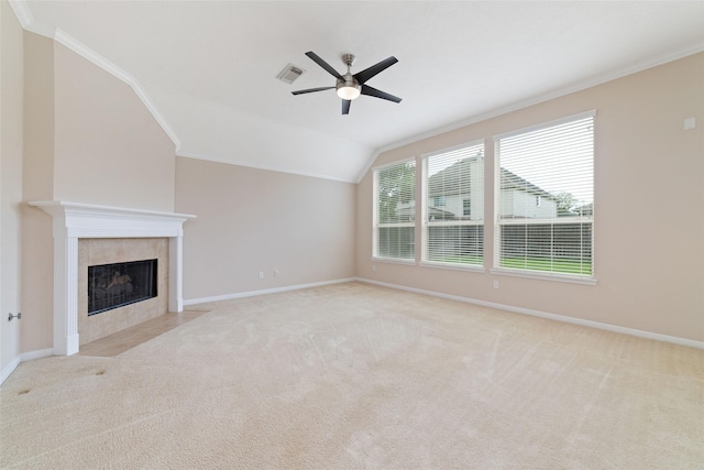 12714 Madera Canyon Ln, Tomball, TX 77377 - unfurnished living room featuring crown molding, ceiling fan, a fireplace, carpet floors, and vaulted ceiling