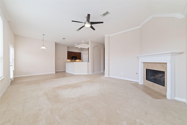 12714 Madera Canyon Ln, Tomball, TX 77377 - unfurnished living room with a fireplace, a ceiling fan, light colored carpet, and ornamental molding