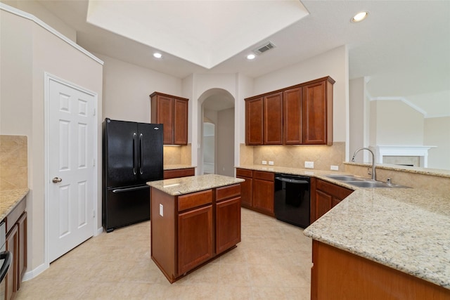 12714 Madera Canyon Ln, Tomball, TX 77377 - kitchen featuring black appliances, arched walkways, backsplash, light stone countertops, and recessed lighting