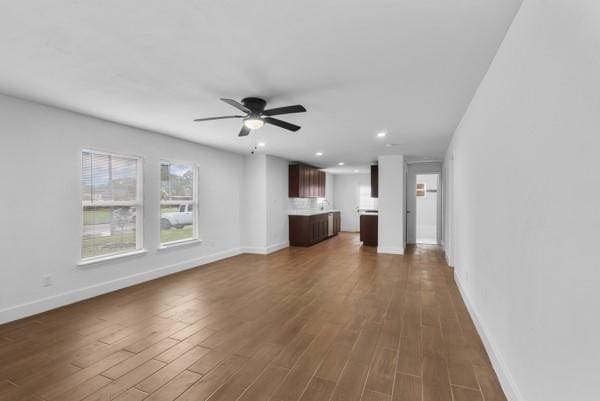 2202 Garvey Dr, Pasadena, TX 77506 - unfurnished living room featuring ceiling fan, dark wood-style flooring, and recessed lighting