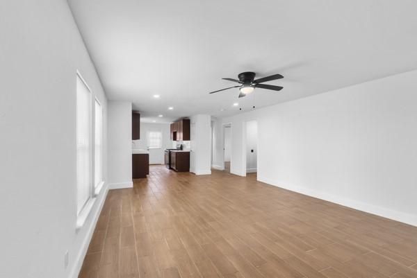 2202 Garvey Dr, Pasadena, TX 77506 - unfurnished living room with ceiling fan, wood finished floors, and recessed lighting