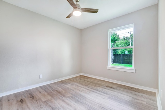 5858 Beldart St, Houston, TX 77033 - empty room with light wood finished floors and ceiling fan
