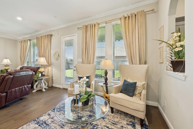 2018 Oxley Manor Ln, Richmond, TX 77469 - living area featuring wood finished floors, crown molding, and arched walkways
