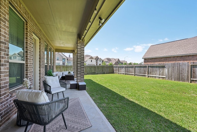2018 Oxley Manor Ln, Richmond, TX 77469 - fenced backyard with outdoor lounge area and a patio area