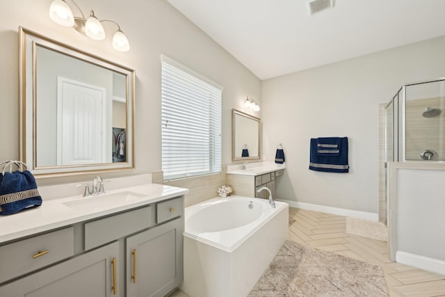 2018 Oxley Manor Ln, Richmond, TX 77469 - full bath with a shower stall, two vanities, and a bath