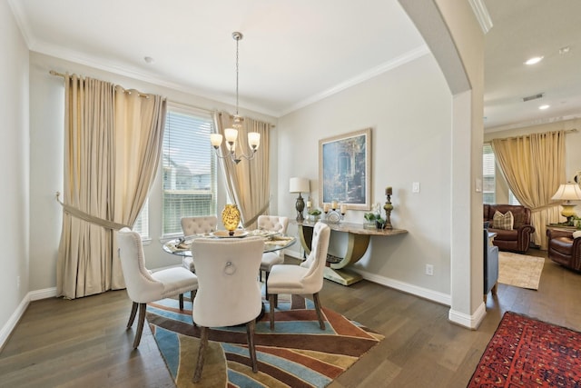 2018 Oxley Manor Ln, Richmond, TX 77469 - dining area with a chandelier, dark wood-type flooring, arched walkways, ornamental molding, and recessed lighting