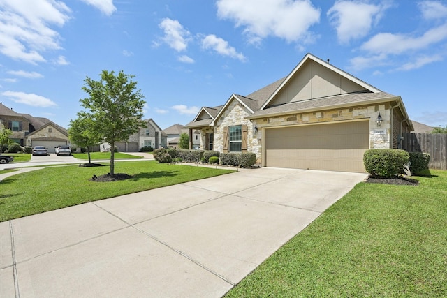 2018 Oxley Manor Ln, Richmond, TX 77469 - view of front facade with stone siding, concrete driveway, an attached garage, and a residential view