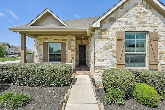 2018 Oxley Manor Ln, Richmond, TX 77469 - property entrance featuring stone siding and roof with shingles