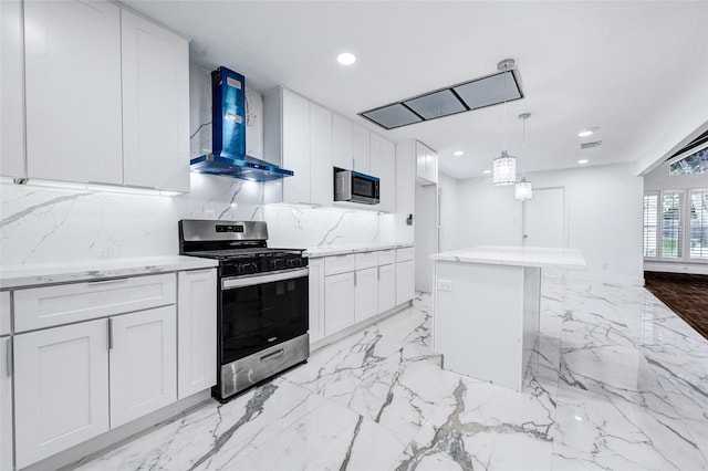 15702 Congo Ln, Jersey Village, TX 77040 - kitchen featuring stainless steel appliances, wall chimney range hood, white cabinetry, recessed lighting, and pendant lighting