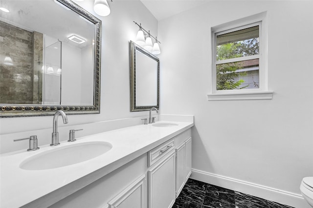 15702 Congo Ln, Jersey Village, TX 77040 - bathroom with marble finish flooring, double vanity, and a tile shower
